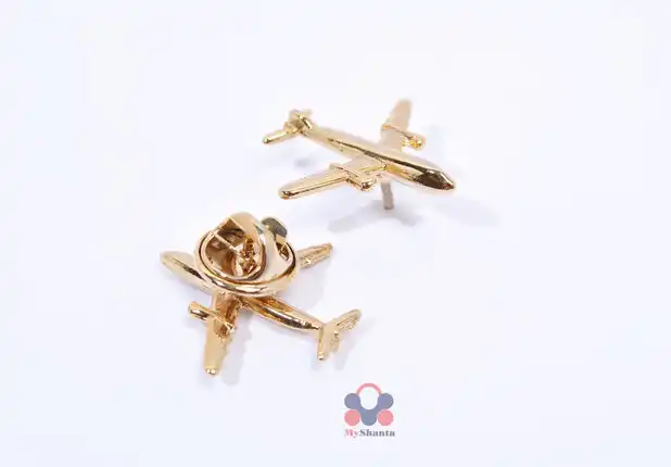 Gold aviator brooch