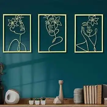 A modern three-piece golden wall frame made of lightweight metal